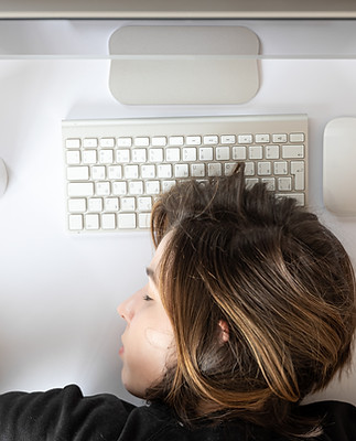flat-lay-young-woman-asleep-front-computer.jpg