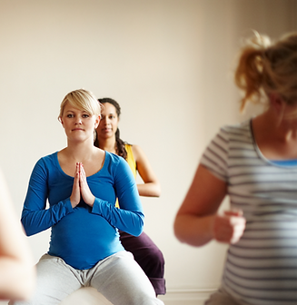 blissful-maternity-multiethnic-group-pregnant-women-meditating-exercise-balls-yoga-class_e