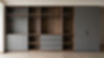 Modern custom joinery Sydney featuring dark grey and wood wardrobes.