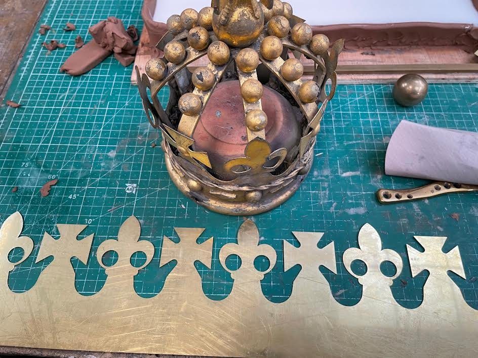 Brass crown section of the replica lantern being made in the workshop