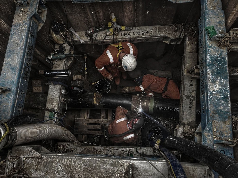 Two welders in protective gear working on a large industrial pipe, with the text 'Welding a Stronger Future' prominently displayed over the image. Below the text, there are buttons labeled 'View Services' in red and 'Contact Us' in grey,