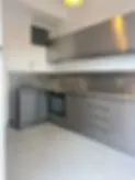 oven in a stainless steel kitchen.webp