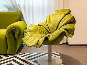 Green leaf-shaped chair with a swivel base
