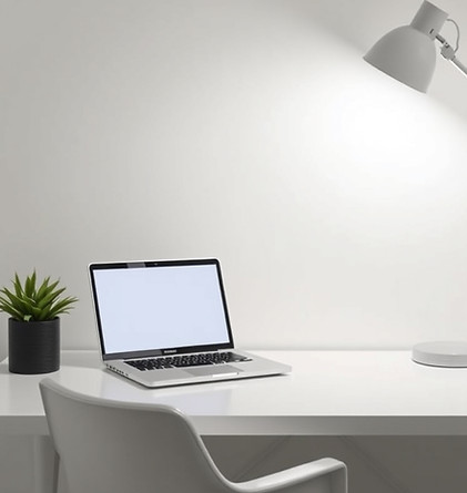 clean work desk with laptop and lamp.jpg