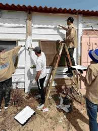 Volunteers helping to rebuild