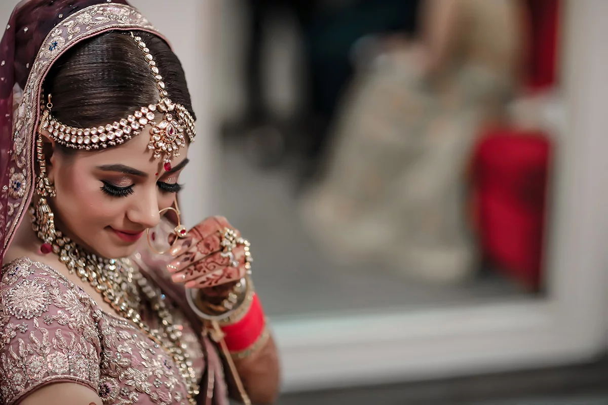 Indian-bride-posing-with-nath-images.webp