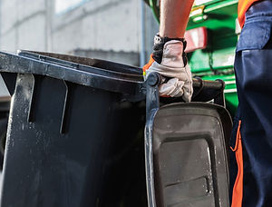 Emptying waste bin and recycling during cleaning service