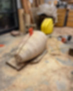 cutting the form in half with a chain saw
