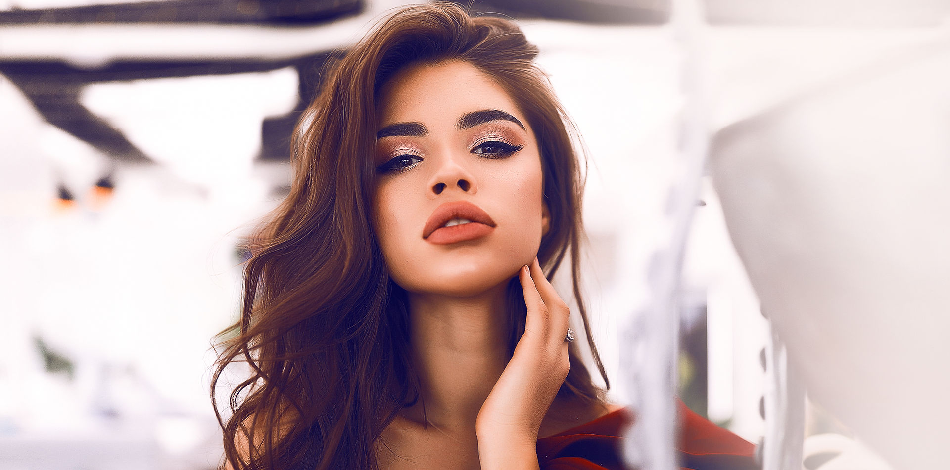 Glamour model touching her neck during photoshoot
