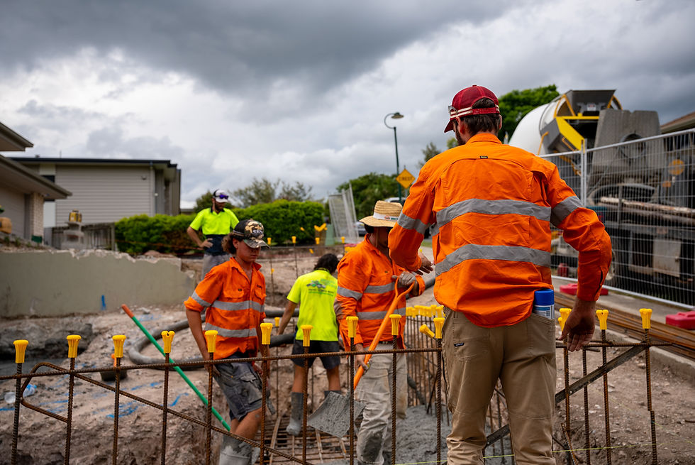 Civil construction workers installing concrete formwork on Brisbane job site