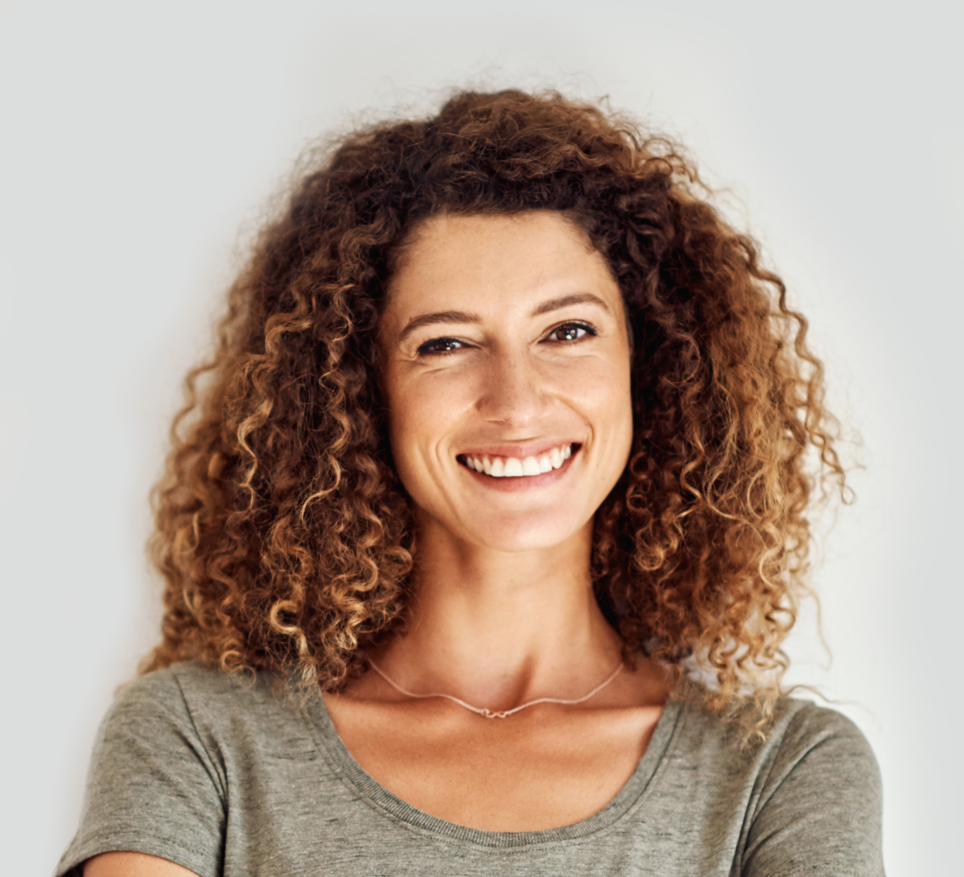 Smiling woman wit hcurly hair