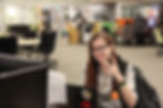 myself posing for the camera while sitting at a computer