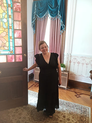 Holly in front of stain glass door