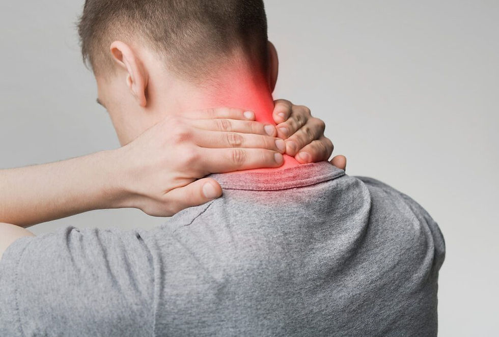 Man holding back of neck in pain