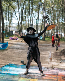 ambient walkabout circus performers in immersive theatrical offering at Elements Music & Arts Festival