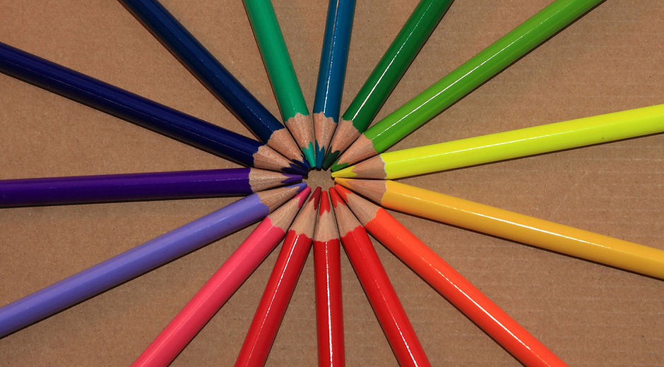 Circle of Colored Pencils Beige Background