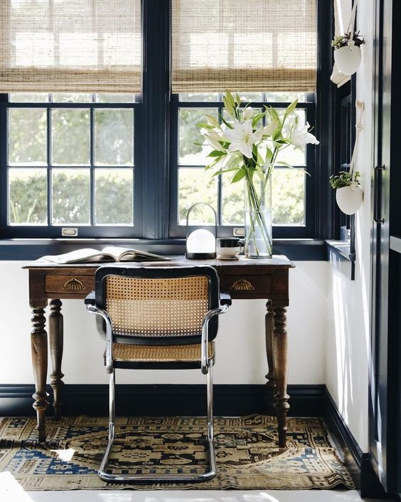 Small Office Desk next to windows with cane chair adorned with beautiful lillies, Small office inspiration from pinterest