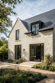 super-high, steeply-sloped roofs, sloped rooflines, floor-to-ceiling windows with delicate grids, and decorative gable vents