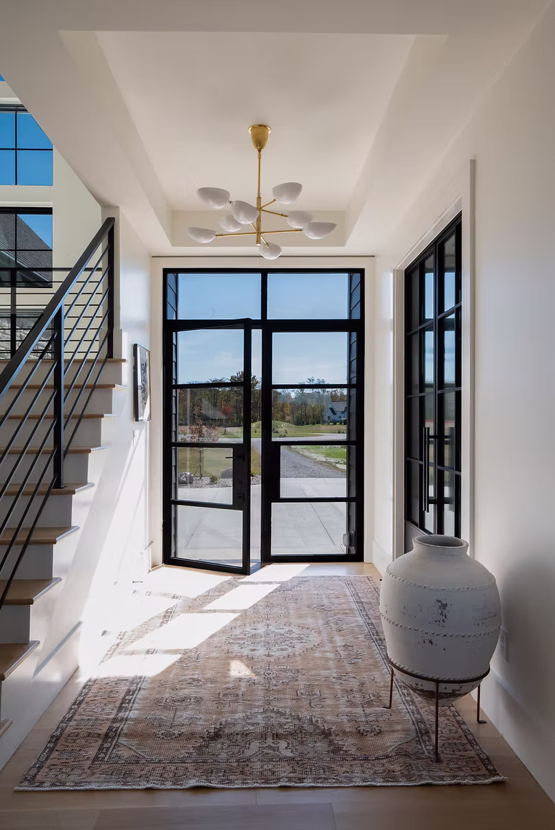 bright and airy entryway with modern doors and finishes