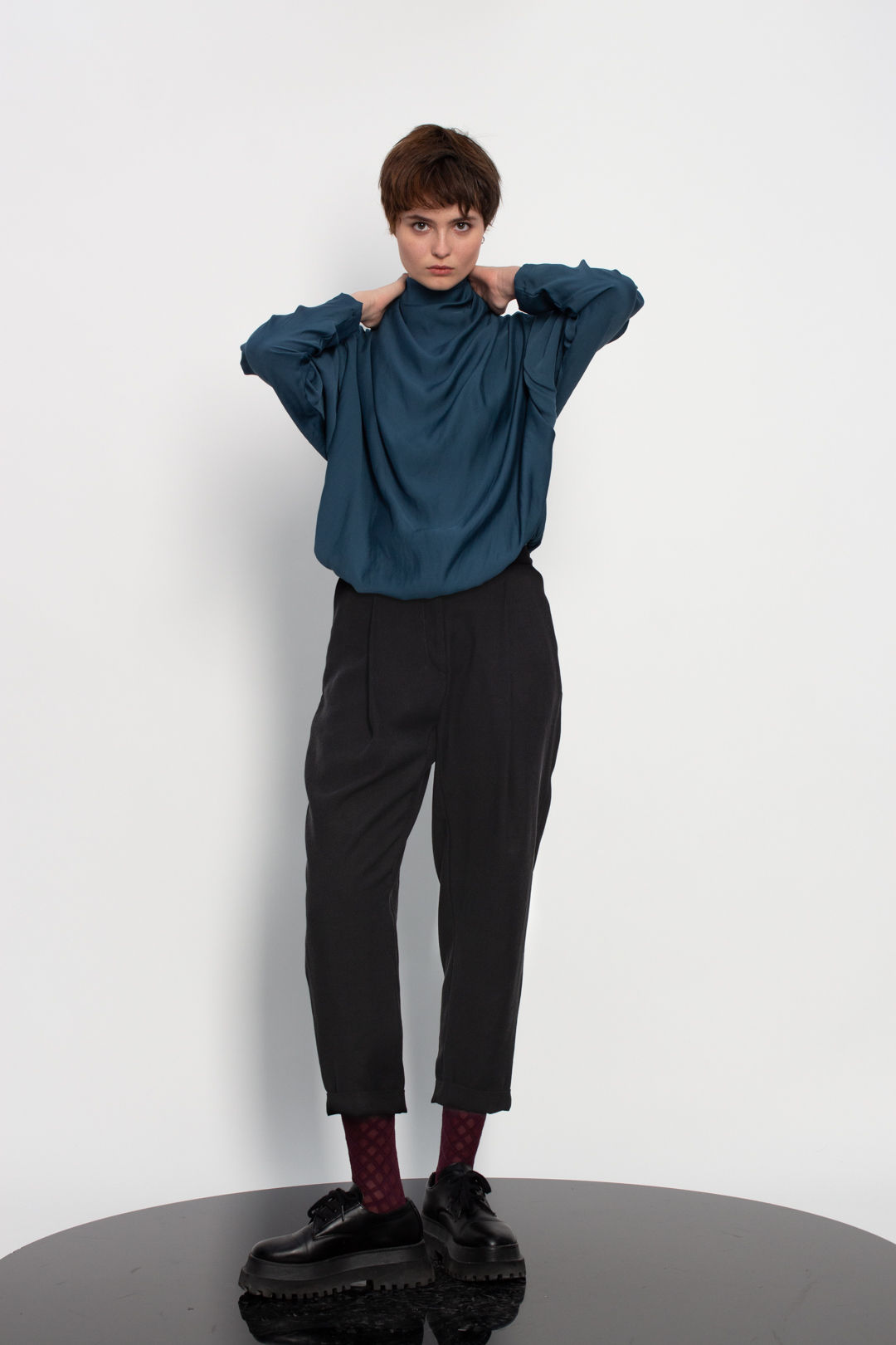 Oblique draped turtleneck top
