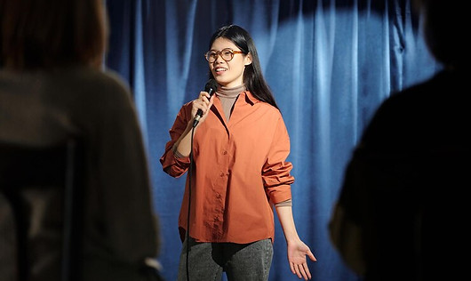 woman-performing-front-audience_274679-48112.jpg