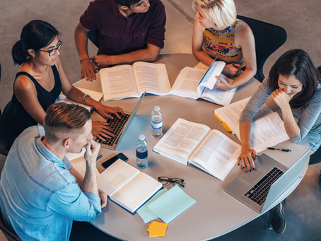 Students studying round a table