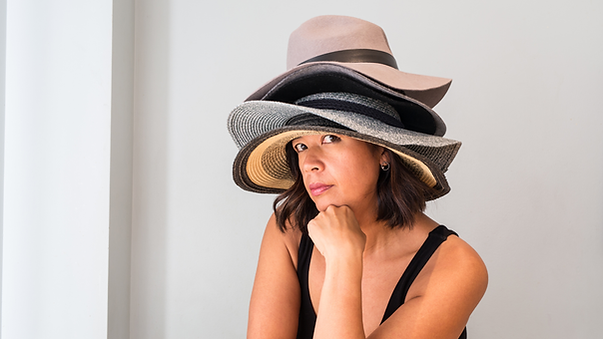 Person wearing lots of hats