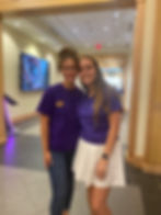 Me and my friend smiling at the Office of Admissions