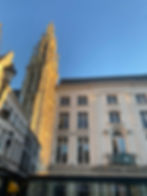 A view of Grote Markt and the Cathedral of Our Lady at sunset