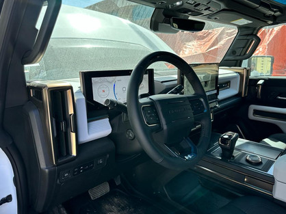 Before Conversion of Hummer EV Pick-up, from left to right-hand drive 