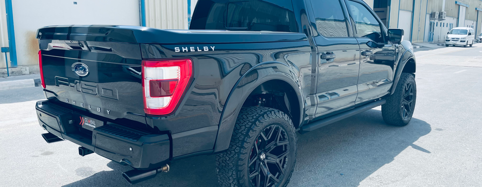 Ford Shelby F 150 pick up SUV blacked out rear end seeing back cabin and wheels 