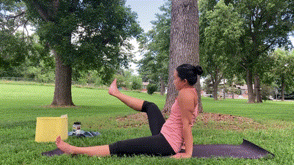 Gif of Jessica Lucey moving into a seated figure 4 stretch