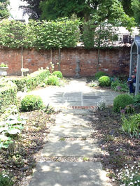 Landscaping design of a garden with a brick wall.