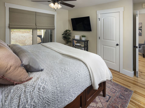 Close view of the king bed with quilted bedding at The Ivy Cottage