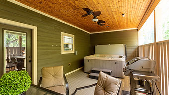 Cypress hot tub on the back deck wirh a gas grill and table for 6