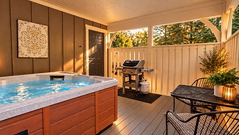 Outdoor patio with hot tub, grill, and bistro seating.
