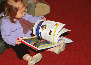 child reading Killari book