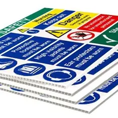 Stacked site safety warning signs with text and symbols for construction site.