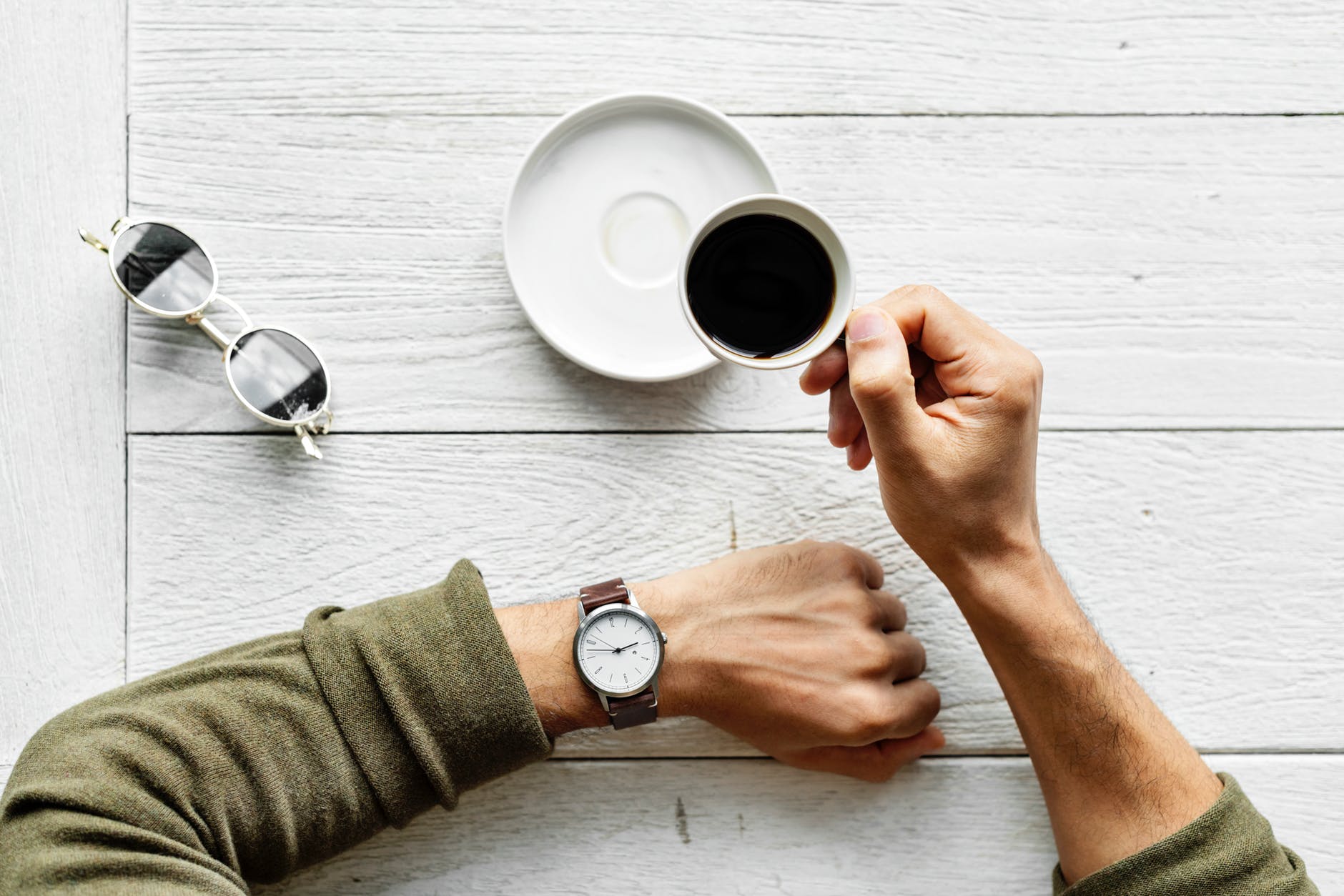 person holding teacup
