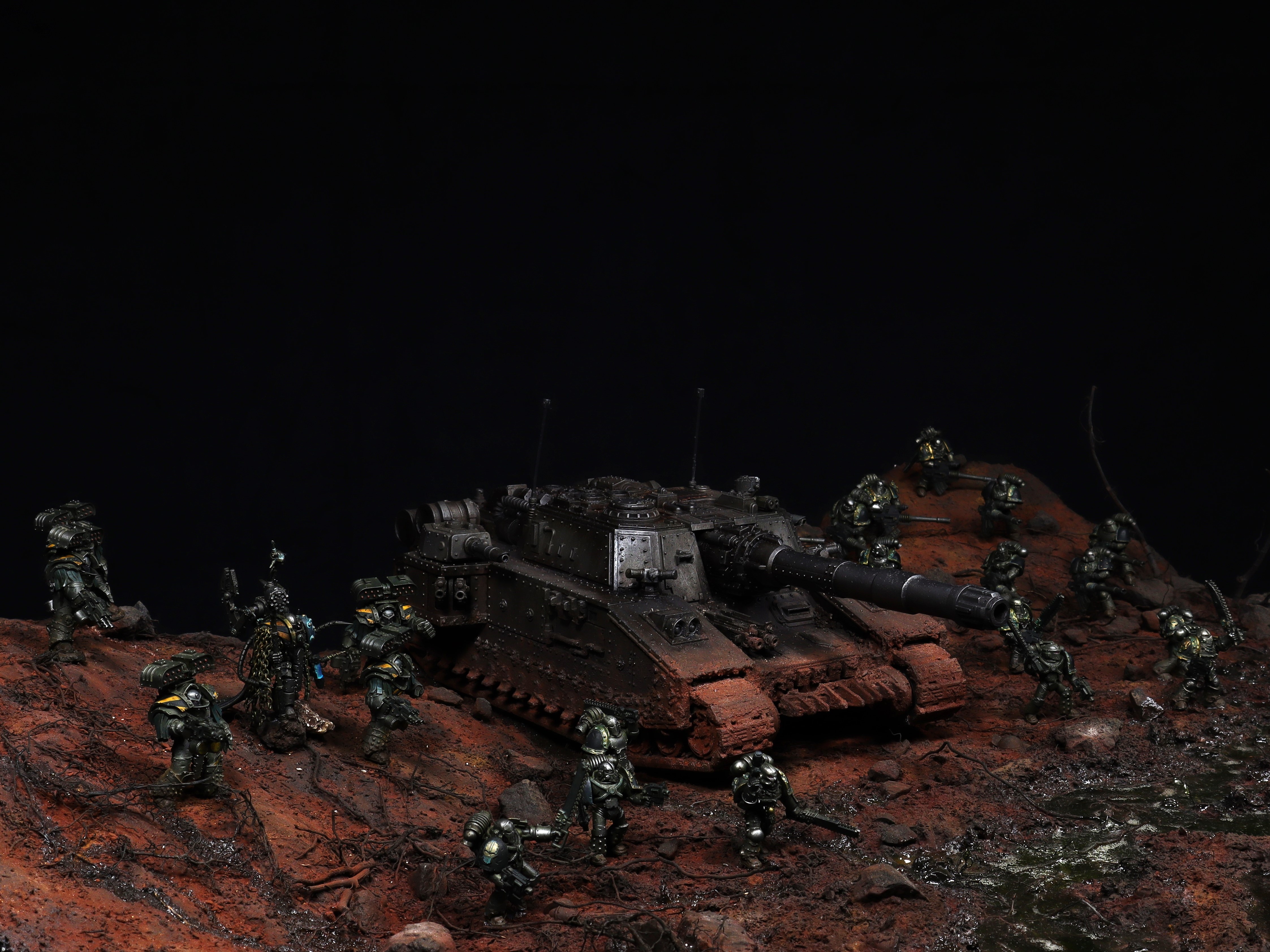 A huge diorama featuring an Iron Warriors siege cohort marching through the battlefield