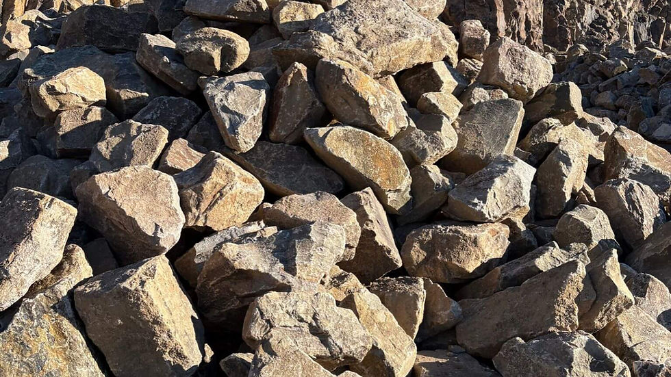 12-24" tan-brown color rip-rap piled at construction site in Marin county