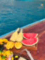 Fresh tropical fruit served on a wooden longtail boat during a Phi Phi private tour from Krabi