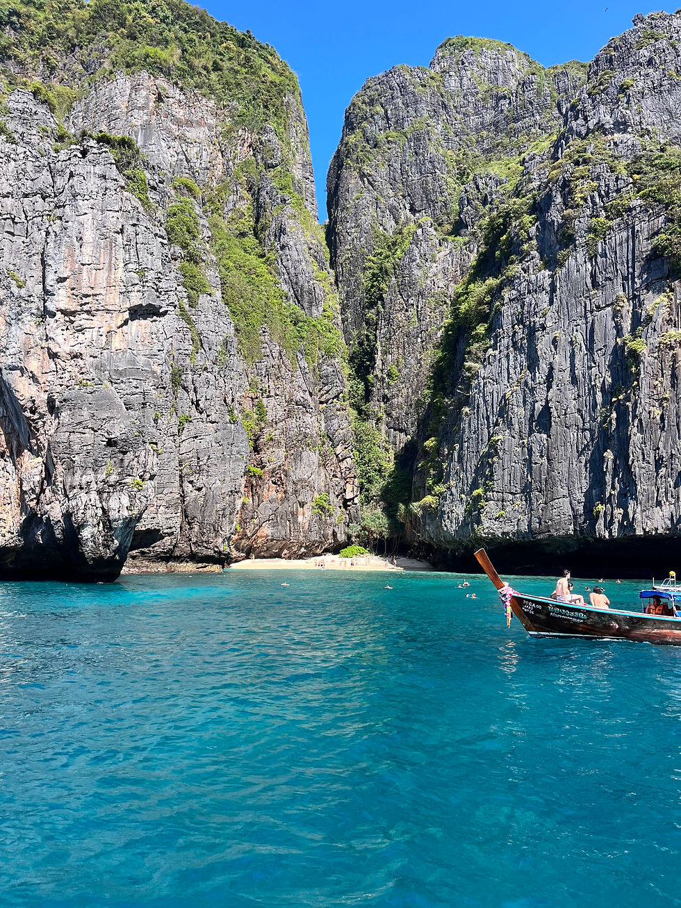 Maya Bay limestone cliffs and turquoise water on a private longtail boat tour from Krabi