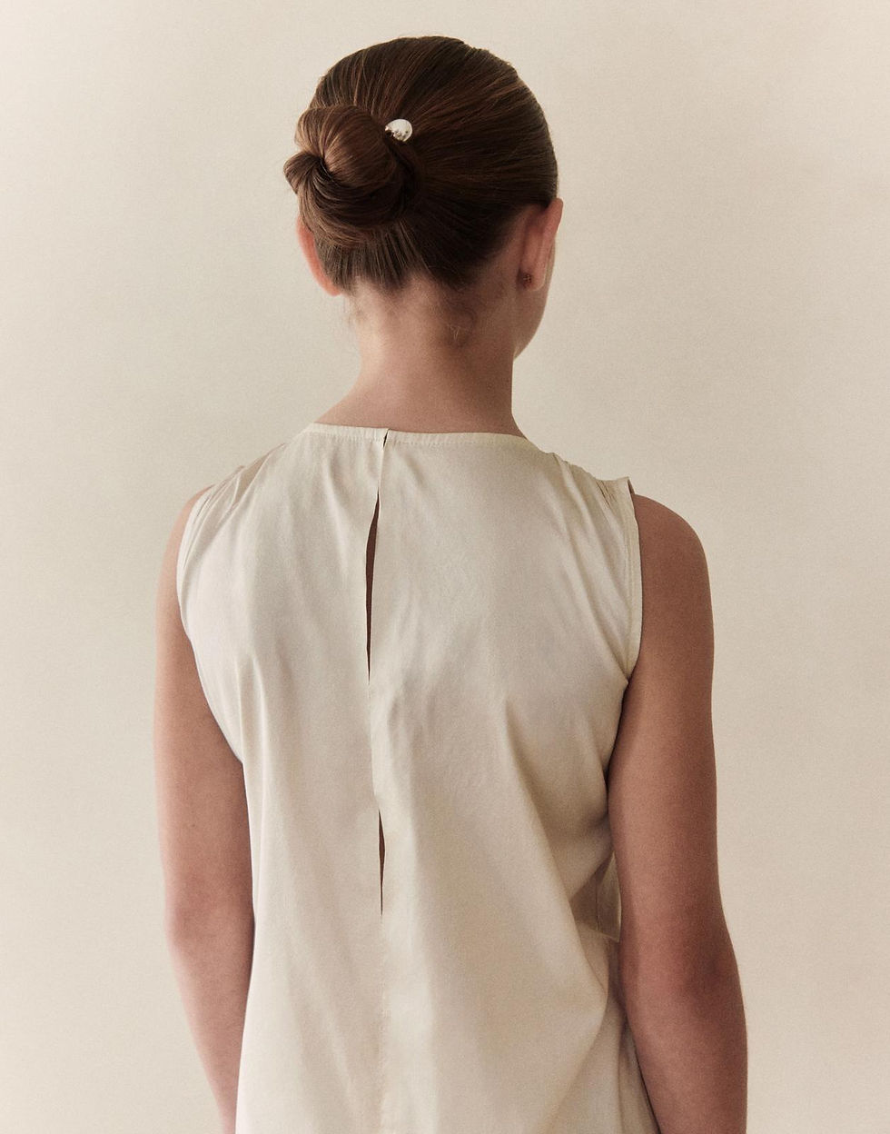 Thumbnail: Daphne dress back view with pearl hair bun — styled by Ciara Aloisio