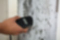Close-up Of A Person's Hand Measuring Wetness Of Moldy Wall.jpg