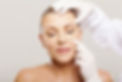 woman with someone touching her face with gloves.jpg