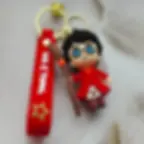 Thumbnail: Harry Potter 3D Keychain in red uniform holding broomstick
