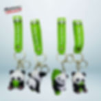 A set of four 3D panda keychains in various poses: one eating bamboo, one hanging upside down, one sleeping, and one holding