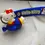 Thumbnail: Cute Hello Kitty 3D keychain in a blue airplane with a matching strap.