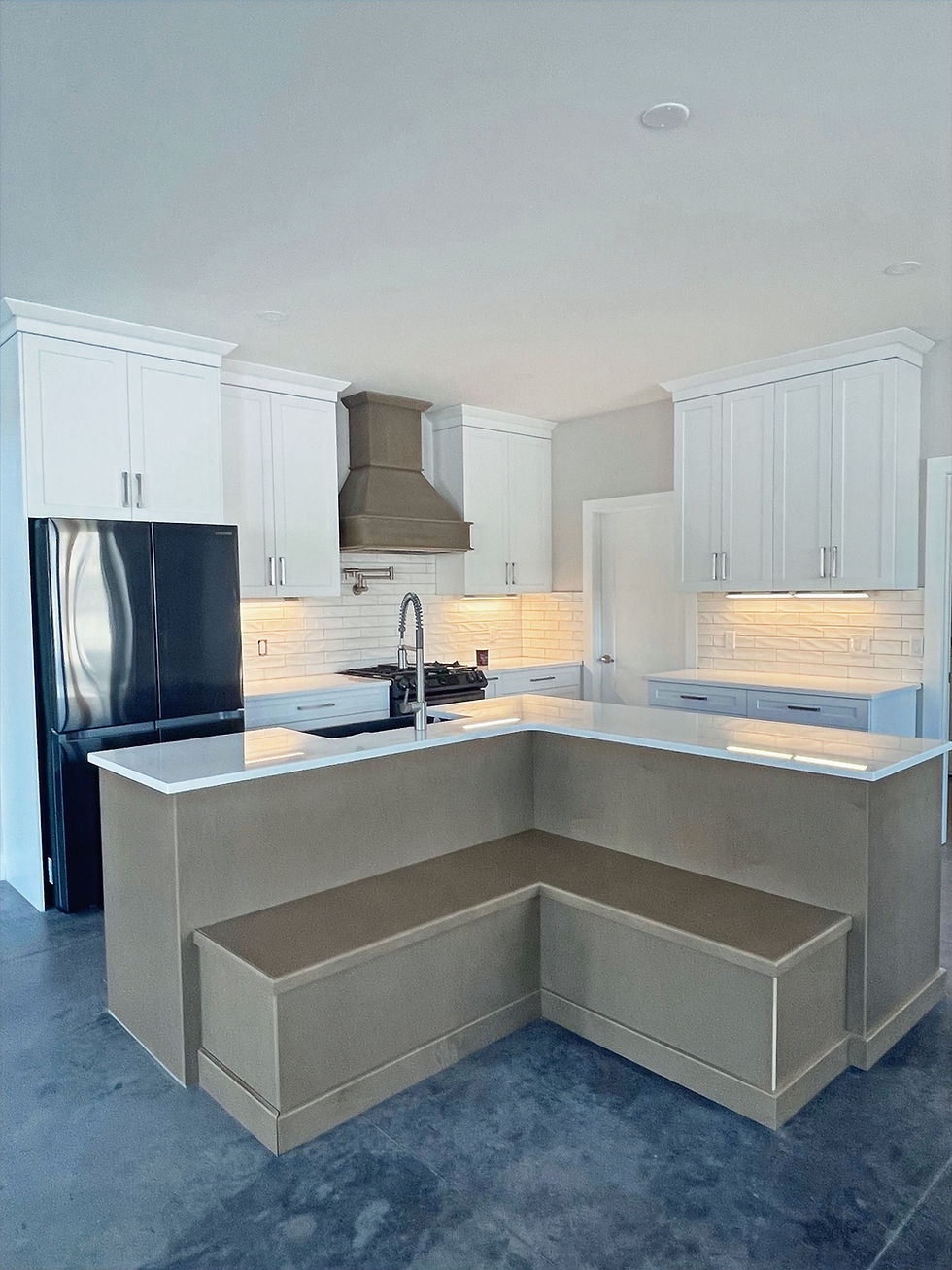 Modern kitchen island by K&M Custom Homes with seating.